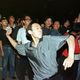 A student throws a rock during a protest outside of the US embassy in Beijing.